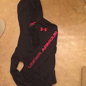 A loose black and red under armour jacket